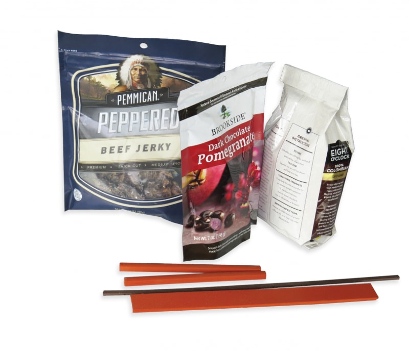  A color photo of custom heat seal sealing bars and three styles of flexible packaging and pouches.