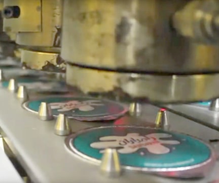 Soft, spoonable food processing machinery  die-cut lidding heat seal sub-system.