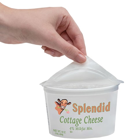 Opening a cottage cheese package with  easy-to-open peelable dairy lidding. This photo is an example of Toray's  easy-to-peel PET white dairy lidding film.