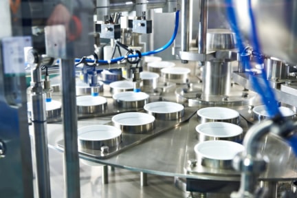 Automated preformed cup rigid packaging rotary filling and lidding machinery.