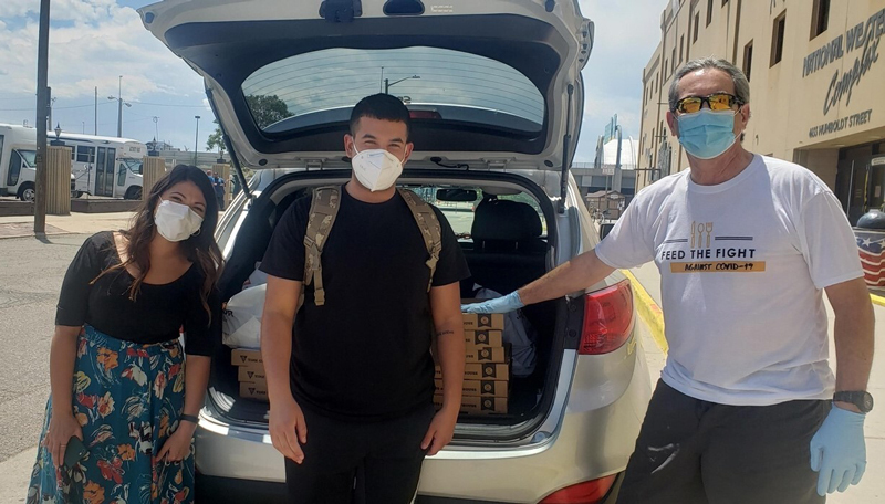 Ashleigh, an anonymous helper and James dropping off suppliess for the Colorado Coalition for the Homeless COVID-19 temporary homeless shelter.