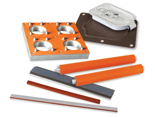 Custom heat seal tooling including a silicone-bonded support fixture, rollers, seal bars, and jaws for packaging applications.