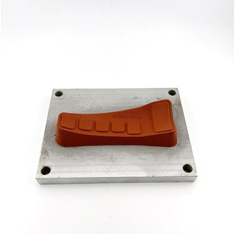 a small metal tool with a silicone coated profile used to apply inks or foils