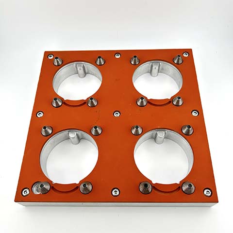 a silicone coated metal fixture to hold dairy cups