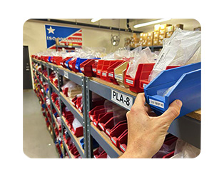 ISM orders being picked from a blue bin from our warehouse